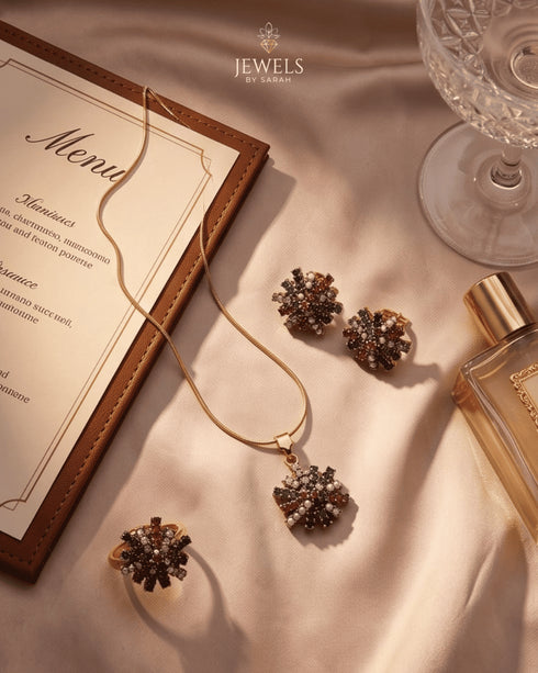 "Multicolor gemstone starburst necklace and earrings styled with menu card and perfume by Jewels by Sarah"