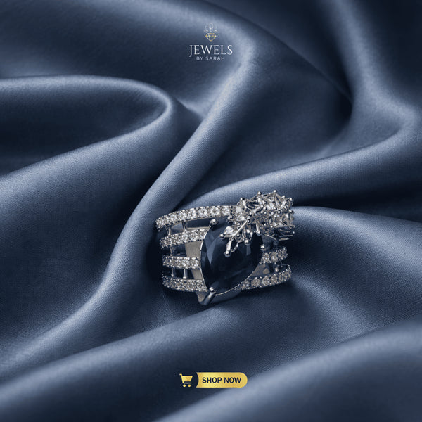 Signature blue pear-cut statement ring on luxury silk by Jewels by Sarah