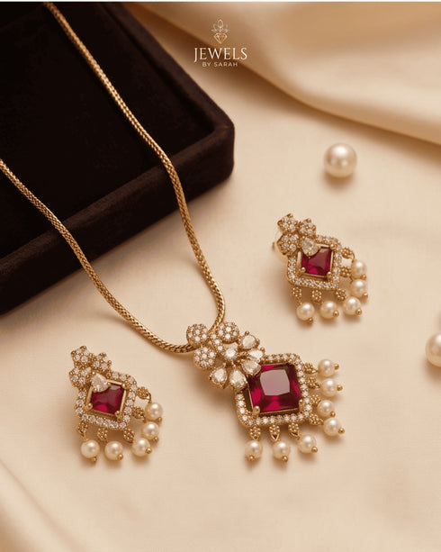 South Indian ruby square necklace and earrings set on beige satin fabric with pearls - Jewels by Sarah