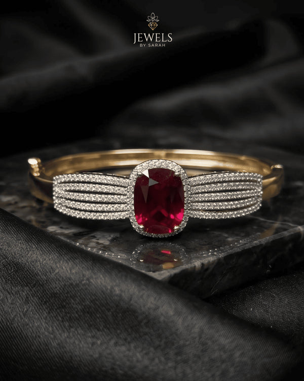 Ruby red zircon statement bangle bracelet on dark marble – Jewels by Sarah