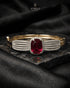 Ruby red zircon statement bangle bracelet on dark marble – Jewels by Sarah
