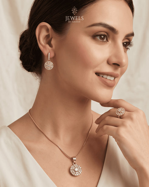 Woman wearing 22K gold zircon necklace, dangle earrings and ring – Jewels by Sarah