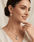 Woman wearing 22K gold zircon necklace, dangle earrings and ring – Jewels by Sarah