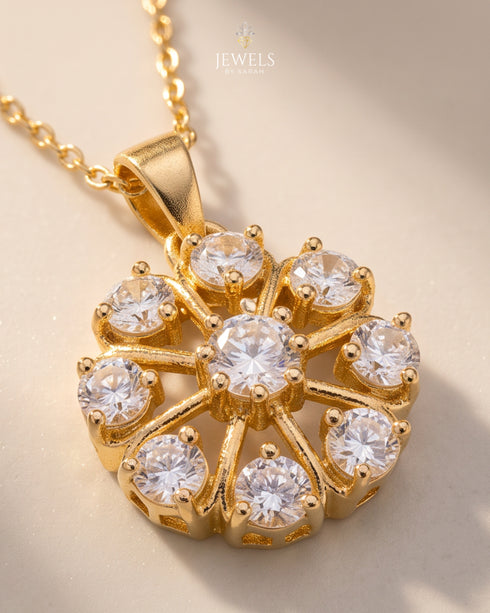 Gold polish spoke-wheel zircon pendant necklace close-up – Jewels by Sarah