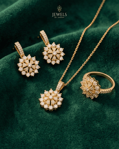 Gold zircon flower jewelry set with necklace, earrings and ring on green velvet – Jewels by Sarah