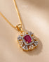 Gold polish ruby center pendant with zircon halo close-up – Jewels by Sarah