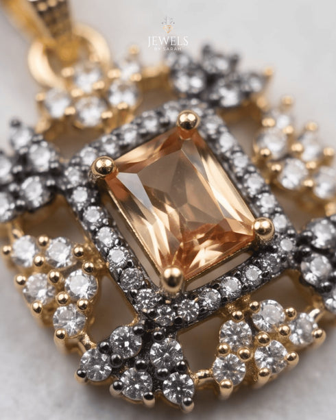 Close-up of gold polish champagne jurao stone pendant with zircon halo detailing – Jewels by Sarah