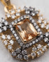 Close-up of gold polish champagne jurao stone pendant with zircon halo detailing – Jewels by Sarah