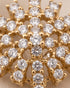 Close-up of sparkling zircon starburst design on gold-tone jewelry by Jewels by Sarah"