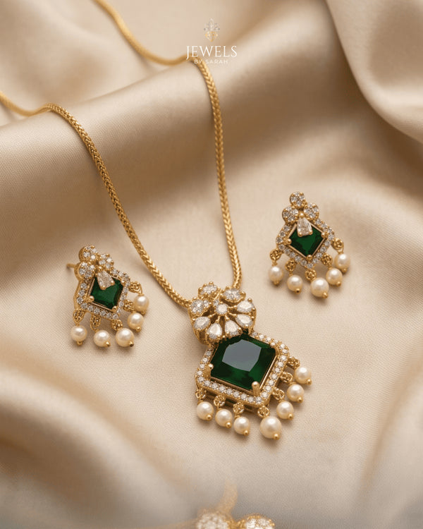 South Indian emerald square necklace and earrings set on beige satin fabric - Jewels by Sarah
