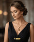 Elegant female model wearing luxury champagne gold tear drop zircon pendant necklace and matching earrings