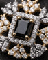 Close-up of jet black jurao stone with zircon halo detailing – Jewels by Sarah