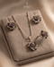 "Multicolor gemstone floral necklace set with earrings and ring on beige velvet by Jewels by Sarah"
