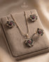 "Multicolor gemstone floral necklace set with earrings and ring on beige velvet by Jewels by Sarah"