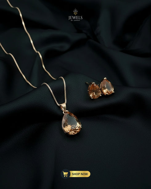 Champagne gold teardrop stone pendant set for traditional Pakistani outfits.