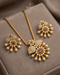 South Indian kemp stone necklace and earrings set with pearl drops on beige velvet box - Jewels by Sarah