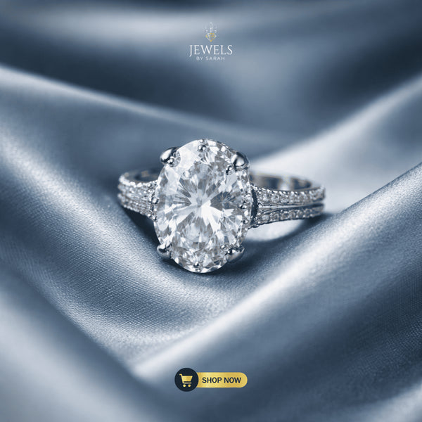 Signature oval brilliant solitaire ring with pavé band on luxury silk – Jewels by Sarah