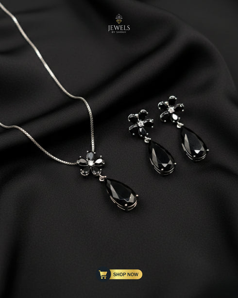 Elegant black stone floral jewelry set for formal evening wear.