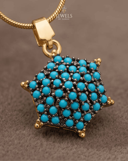 "Close-up of feroza turquoise star cluster pendant on gold chain by Jewels by Sarah"