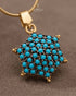 "Close-up of feroza turquoise star cluster pendant on gold chain by Jewels by Sarah"