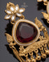 Close-up of maroon stone and peacock motif on Kashmiri style jhumka earring - Jewels by Sarah