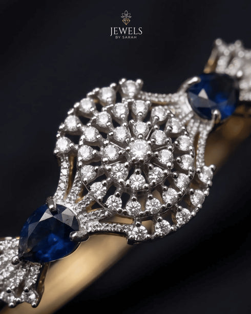 Close-up of zircon sunburst medallion with sapphire blue accent stones – Jewels by Sarah