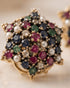 "Close-up of multicolor gemstone star cluster ring with ruby, sapphire, emerald and pearl stones by Jewels by Sarah"