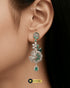 The "Emerald Camellia" Grand Chandelier Drops – Intricate Mint Green Zircon & Premium AD Stone Earrings in Rhodium Finish