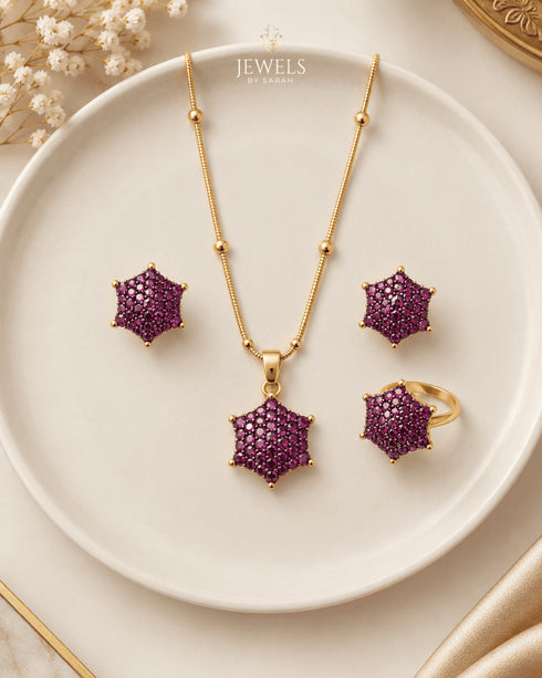 "Ruby colored star cluster necklace set with earrings and ring on ceramic plate by Jewels by Sarah"