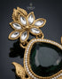 Close-up of emerald green stone and kundan floral detail on Kashmiri style jhumka earring - Jewels by Sarah