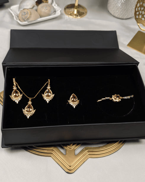"Champagne gold marquise sunburst jewelry set displayed in black gift box packaging"