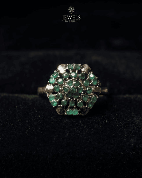 "Emerald cluster gold plated ring with antique finish on black velvet by Jewels by Sarah"