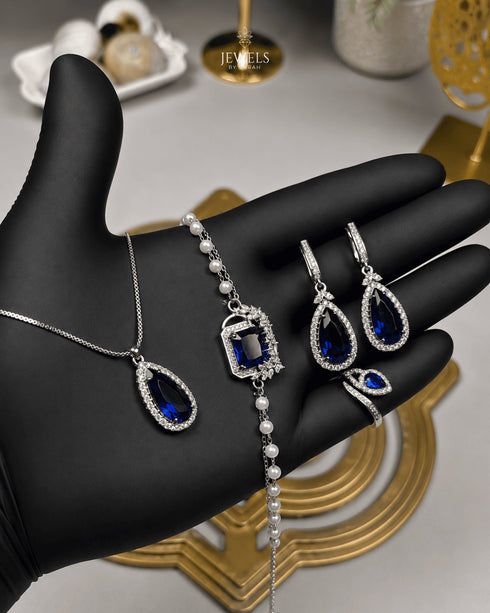 "Sapphire blue teardrop pearl halo jewelry set with necklace, bracelet, earrings and ring"