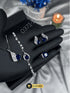 Royal blue stone jewelry set including necklace, earrings, and ring for women.
