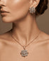 Model showcasing the luxury gold-plated American Diamond pendant necklace and matching earrings in brilliant diamond cut style.