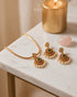 Kemp pearl necklace set with matching earrings styled on marble table with candle - Jewels by Sarah