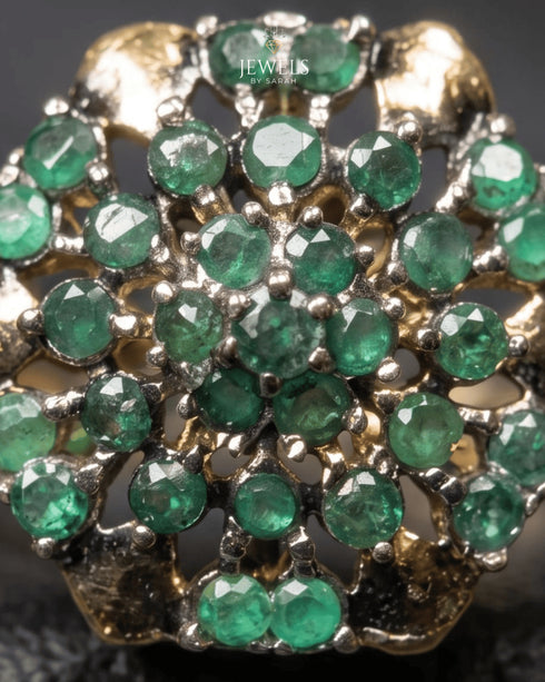 "Close-up of emerald stones and honeycomb setting on antique gold plated ring by Jewels by Sarah"