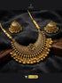 Antique Matte Gold Chandbali Necklace and Jhumka Set with Floral Detail.
