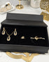 "Gold teardrop pearl jewelry set displayed in black gift box packaging"