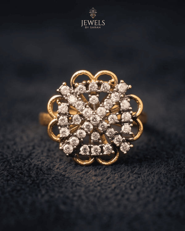 "Crystal floral gold plated ring with scalloped design on dark fabric by Jewels by Sarah"