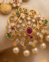 "Close-up of antique gold temple pendant with ruby, emerald and pearl detailing by Jewels by Sarah"