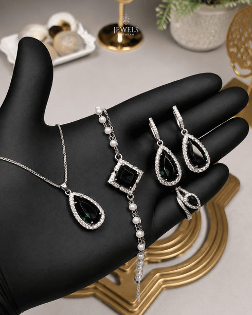 "Emerald green teardrop pearl halo jewelry set with necklace, bracelet, earrings and ring"