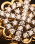 "Close-up of sparkling crystal pave and gold scalloped edge on statement ring by Jewels by Sarah"
