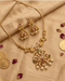"South Indian temple necklace set with jhumka earrings styled with gold coins and rose petals"