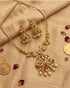 "South Indian temple necklace set with jhumka earrings styled with gold coins and rose petals"