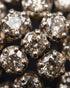 Close-up of faceted zircon stones in cluster ring setting – Jewels by Sarah