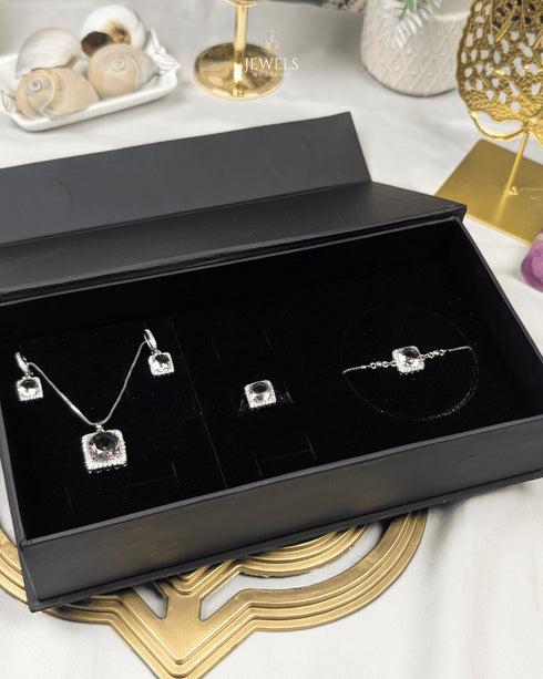 "Baby pink halo crystal jewelry set displayed in black gift box packaging"