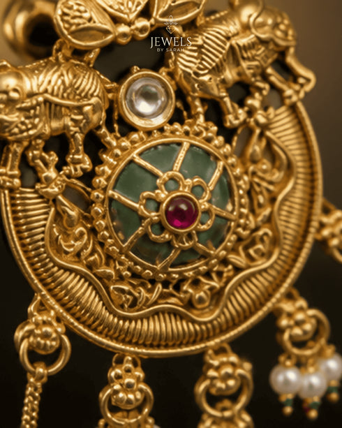 Close-up of elephant motif and gemstone detailing on Kashmiri style tassel earring - Jewels by Sarah