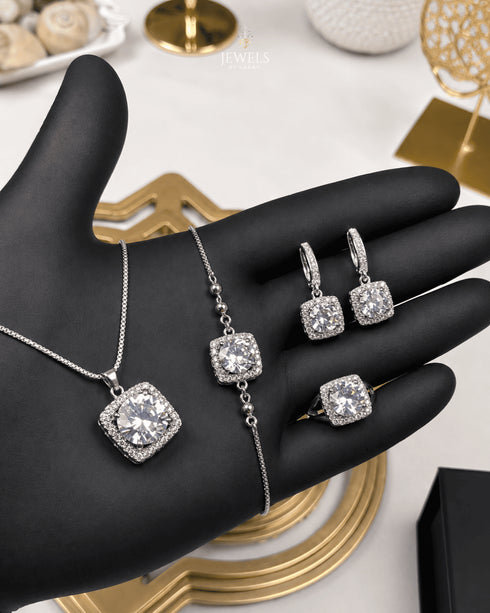 "Clear crystal halo jewelry set in silver with necklace, bracelet, earrings and ring"