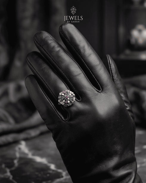 "Model wearing multicolor gemstone antique statement ring on black glove by Jewels by Sarah"